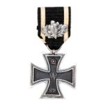 A Prussian 1870 Iron Cross 2nd class, with 25th Anniversary oak leaf clasp on the ribbon. GC Plate 1