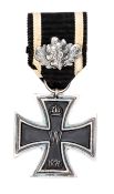 A Prussian 1870 Iron Cross 2nd class, with 25th Anniversary oak leaf clasp on the ribbon. GC Plate 1