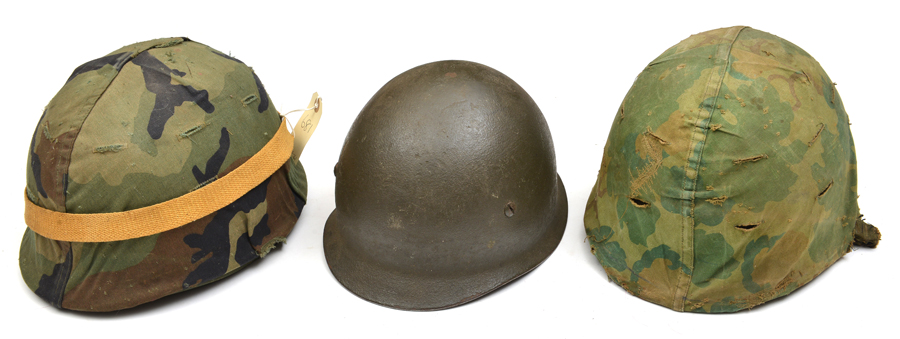 2 US steel helmets, with fibre liners and cloth camouflage covers; and another with leather liner,