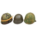 2 US steel helmets, with fibre liners and cloth camouflage covers; and another with leather liner,