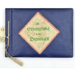 A Third Reich photograph album, the cover with coloured panel inscribed “Zur Erinnerung a.m.