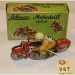 A Schuco Motodrill Motorcycle (No.1006). A clockwork tinplate motorcycle, racing number 3 to back of