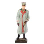 A Lineol figure of Field Marshall Hindenburg. Standing in grey winter greatcoat with cap and