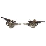 2 Hausser tinplate field guns. With elevating wheels and cocking levers, made to fire wooden