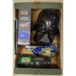 A small quantity of Star Wars related items. An original Don Post Star Wars Darth Vader black