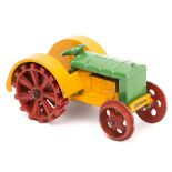 A scarce 1930’s Meccano Dinky Toys Farm Tractor 22e. An example in yellow and green with red wheels,