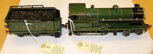 An O gauge Bing 4-4-0 steam tender locomotive. An electric example in British L&NER (London &