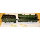 An O gauge Bing 4-4-0 steam tender locomotive. An electric example in British L&NER (London &