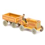 A 1920’s German tinplate penny toy style tractor and trailer. 120mm combined length, four wheeled
