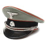 A Third Reich SS Artillery (?) officer’s peaked cap, of light field grey cloth with black velvet