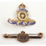 An enamelled gold “sweetheart” badge of The R Artillery, well detailed cannon, marked “9ct Gold”,