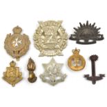 7 Commonwealth cap/glengarry badges, including Cyprus Regt, K O Malta Regt, bronze RWAFF with slide,