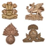 4 WWII infantry plastic cap badges: Buffs, R Fus, Lancs Fus and Welch. GC to VGC Part of a Private