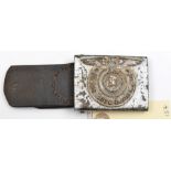 A Third Reich SS man’s steel belt buckle, with silver painted finish and leather tab. GC (paint