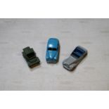 3 Dinky Toys. A Standard Vanguard (153) in mid blue with fawn wheels. An Armstrong Siddeley (38e) in