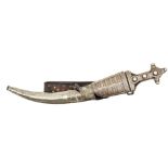 A Wahabite jambiya, flat blade 16½”, with slender decorated panel at forte, darkwood hilt overlaid