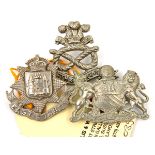 3 all WM cap badges: late Vic E Surrey with flat topped crown and N Staffs; a Manchester corporation