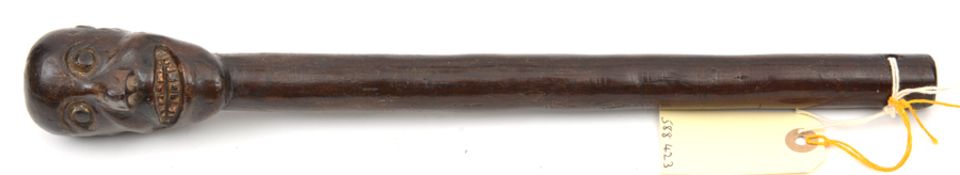 A small 19th century African hardwood club, head in the form of a grinning face, 15½” in length. GC