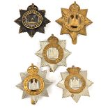 5 Devonshire Regt cap badges, Vic, KC voided and non voided, WWI all brass and blackened 4th Bn,