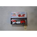 A Dinky Supertoys Turntable Fire Escape (956). An example in red and silver. Includes 8x firemen,