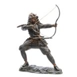 A Japanese bronzed figure of a Samurai archer, in full armour, with katana and wakizashi at waist,