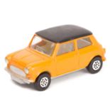 Corgi Whizzwheels Morris Mini Minor. An example in orange with matt black roof and cream interior.