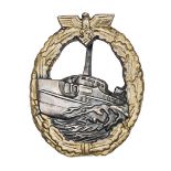 A Third Reich E Boat badge, first pattern, gold lacquered wreath, bronzed boat, marked “Schwerin