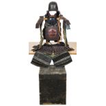 A suit of Japanese armour, black lacquer Hineno helmet of 4 plates, brown lacquer Do with detached