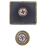 A scarce Third Reich gold party badge, marked “9129 A H 30.1.39 Hans Meyer Ges Gesch” and in its