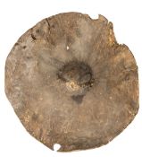 A scarce Hadendowa warrior’s elephant hide war shield, c 1880, of typical circular form, with