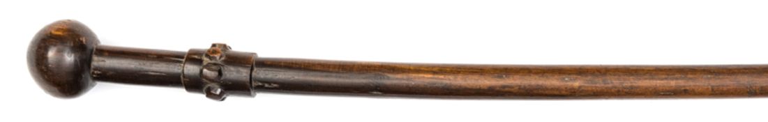 An unusual Zulu Chief’s staff, the stem of very slightly tapered form, with a carved studded band at