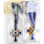 A Third Reich Mothers Cross in gold, also another in silver. GC