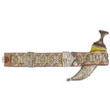 A Yemen jambiya, broad polished blade 9”, with central rib, darkwood hilt with embossed gilt and