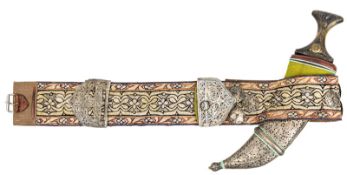 A Yemen jambiya, broad polished blade 9”, with central rib, darkwood hilt with embossed gilt and