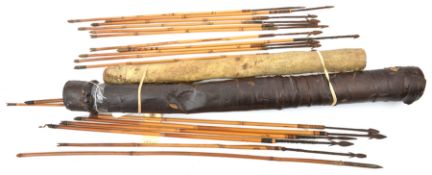 A parchment covered quiver, containing 11 various iron tipped bamboo arrows, average 22”, old