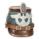 A good Third Reich rural police shako, with field grey body, brown finish top and peaks, alloy