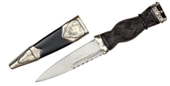 A small silver mounted skean dhu, blade 3½”, darkwood hilt with strapwork outer face, facetted