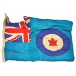 A WWII flag of the Royal Canadian Air Force, Union flag and maple leaf roundel on turquoise