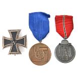 A Third Reich East Front medal, with ribbon; also a 1939 Iron Cross 1st class, of one piece non