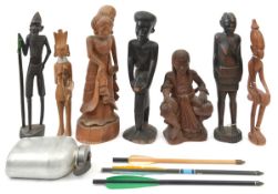 7 various carved wooden figures of African, Polynesian, etc, interest, and an alloy water bottle.