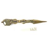 A Tibetan all brass exorcising dagger, phurbu, triple leaf “blade” 2½”, hollow pierced baluster stem