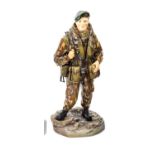 An Ashmor Falklands commemorative painted porcelain figure of a R Marine, 40,42 and 45 Commando,