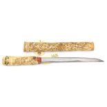 A composite Japanese carved bone dagger Aikuchi, blade 25.3cms, cut with short hi, ito suguha hamon,