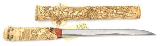 A composite Japanese carved bone dagger Aikuchi, blade 25.3cms, cut with short hi, ito suguha hamon,