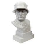 A c 1930s period white porcelain bust of a German soldier, wearing WWI pattern steel helmet,