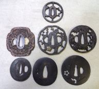 7 assorted tsuba, comprising a mokko copper example chiselled with flowering plants, the rim with