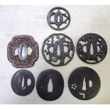 7 assorted tsuba, comprising a mokko copper example chiselled with flowering plants, the rim with