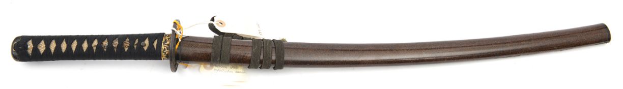 The koshirae (fittings) for a Japanese sword wakizashi, wooden “blade” 60.5cms, iron Goto tsuba with