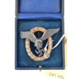 A Third Reich Luftwaffe Pilot’s badge, the reverse of the eagle stamped “C E Juncker, Berlin SW 68”,