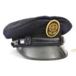 A scarce Third Reich DAF peaked cap, black cloth with oakleaf band, gilt badge with Bevo motif;